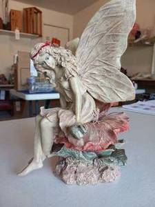 lot 190 image: Angel on flower statue...
