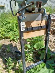 lot 116 image: Homelite 4 Cycle 55 hp. Outboard - Model 460A2B, Serial No. 1650811 with Heavy Metal Stand