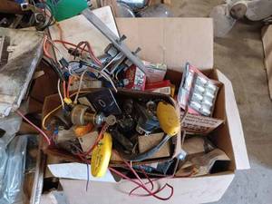 lot 239 image: Large Pallet of Parts including Chrome Lights, New Spark Plugs, Ignition Switches, Bearing Buddy Gauges, Trailer Light Lenses, and More