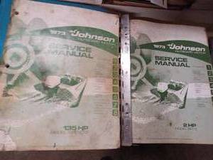 lot 428 image: 1973 Johnson Outboard Manuals, 1996 JohnsonEvinrude Master Parts Price Book, and a Chrysler Outboard Service Manual