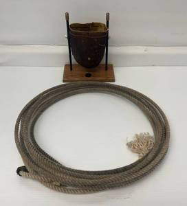 lot 5 image: Vintage Lasso And Bull Skin Tipping Bucket