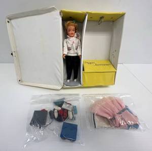 lot 100 image: Vintage 1960s Ideal Corp. Pepper Doll With Carrying Case And Some Clothes