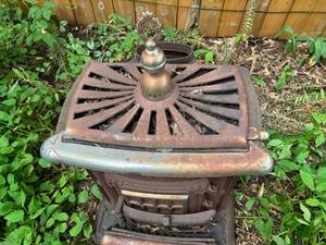 lot 37 image: Cast Iron Stove Lawn Ornament (On Site Pickup In Stillwater)