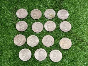 lot 67 image: 15 Ike Dollars