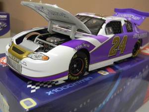 ACTION RACING 124 SCALE DIE-CAST - #24 JEFF GORDAN LIMITED EDITION THE JEFF GORDAN FOUNDATION STOCK CAR - VERY COOL PIECE - NEW IN BOX - SEE PICTURES