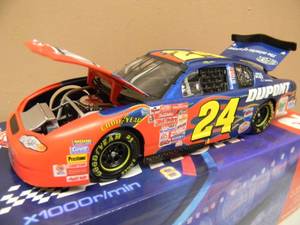 ACTION RACING 124 SCALE DIE-CAST - #24 JEFF GORDAN LIMITED EDITION DUPONT MOTORSPORTS STOCK CAR - VERY COOL PIECE - NEW IN BOX - SEE PICTURES