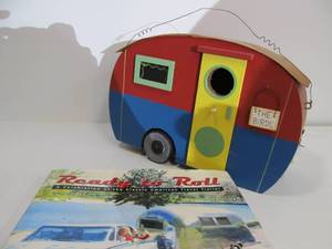 lot 39 image: Unused Travel Trailer Bird House & Coffee Table Book