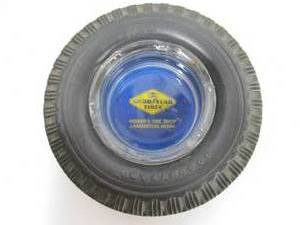 lot 55 image: Larger Vintage GOODYEAR Advertising Tire Ashtray - Homers Tire Shop - Lamberton, Minn