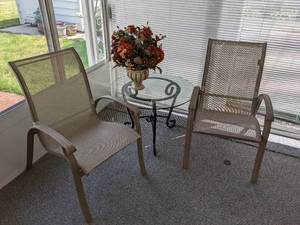 lot 26 image: Pair of Patio Chairs, Glass Topped Patio Table and Faux Flower Arrangement