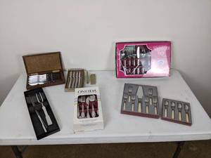 lot 120 image: Washington Forge and Oneida Stainless Silverware Sets, Carving Fork & Knife, and (2) Sets of Steak Knives