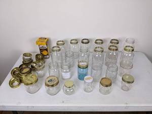 lot 123 image: Assortment of (25) Canning Jars, Lids, and Rings in Various Sizes - Ball, Kerr, and more