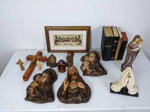 lot 122 image: Catholic Christian Wall Plaques, Sacred Heart of Jesus, Mary and Baby Jesus, Wood Crucifix, Praying Hands, Pysanky-Style Egg, Unique Framed Last Supper Relief, Vintage Bibles (English and German), Saint Francis & Saint Joseph Statues