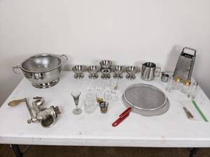 lot 148 image: Vintage Climax Meat Grinder with Wood Handle, Grater, Stainless Strainer, Shot Glasses, Sifters, Salt and Pepper Shakers, Stainless Pitcher and Cups