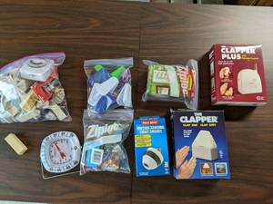 lot 168 image: Variety of Useful Household Items 2 Clappers, Timers, Outlet Extenders, Chip Clips, ThumbtacksPush Pins, and More