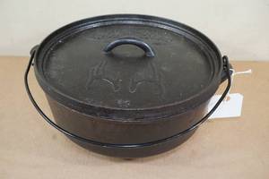 lot 149 image: Sportsmans Warehouse Cast Iron Dutch Oven