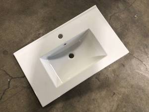 lot 26 image: White Ceramic Top with White Sink Granite Top Only Customer Returns See Terms on Auction