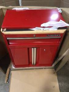 lot 34 image: Ready-to-Assemble 24-Gauge Steel 1-Drawer 2-Door Garage Base Cabinet in Red (28 in. W x 33 in. H x 18 in. D) by Husky Customer Returns See Terms on Auction