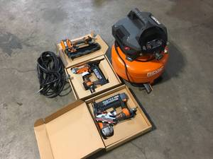 Ridgid 6 Gal. Portable Electric Pancake Air Compressor w 18GA Brad Nailer, 16GA Straight Finish Nailer, & 18GA Finish Stapler Customer Returns See Terms on Auction