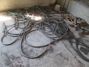 Corner lot of wood and hoses (see p...