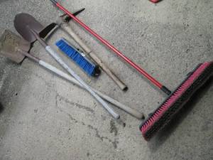 2 shovels, pick axe and shop broom...