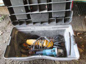 Dewalt and Makita grinders in a pla...