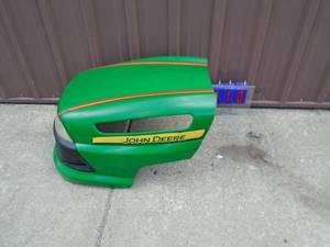 John Deere plastic hood. Good used condition with a few small cracks. As shown.