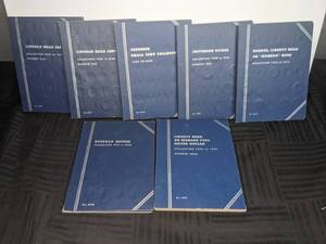 Assortment of Coins Inside 7 Coin Folders  X