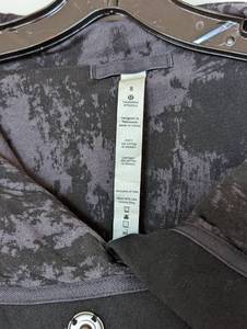 lot 124 image: Lululemon Black and Grey Wrap Jacket