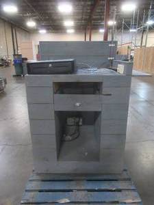 lot 251 image: RETAIL CASH REGISTER CHECKOUT ISLAND, Approximately 36 x 25 x 52 12 Tall, 39 12 Work Top. With cash drawer and power hook up - Used in retail store.