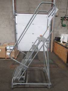 lot 258 image: STEP LADDER WITH CAGE AND SAFETY LOCK - Approximate Dimensions 29 x 39 x 51 (Top Step Height). - USED IN WAREHOUSE