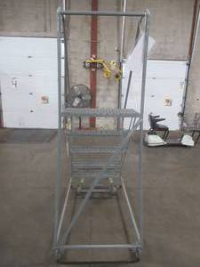 lot 259 image: STEP LADDER WITH CAGE AND SAFETY LOCK - Approximate Dimensions 27 x 48 x 51 (Top Step Height). - USED IN WAREHOUSE