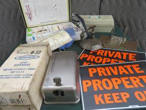 lot 98 image: FIRST AID KIT, DYMO TYPEWRITER, BOBRICK SOAP DISPENSER, CLIPBOARDS & SIGNS