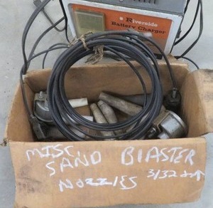 lot 102 image: MISC. SAND BLASTER NOZZEL 332 AND UP & VINTAGE RIVERSIDE BATTERY CHARGER