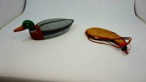 lot 9 image: Duck decoy and leather pouch made in Spain