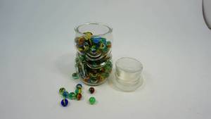 lot 19 image: Marbles and Shooters in Covered Jar