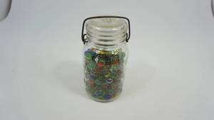 lot 20 image: Marbles and Shooters in Covered Jar