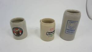 lot 48 image: Set of three advertising beer steins