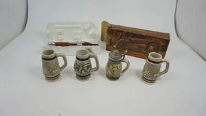 lot 55 image: Avon dueling pistol aftershave bottle, various vintage beer steins