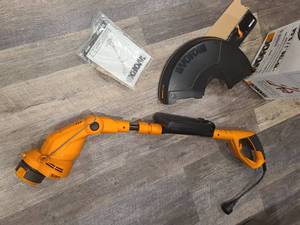 lot 146 image: WORX 15 5.5-Amp Corded Electric Grass TrimmerEdger