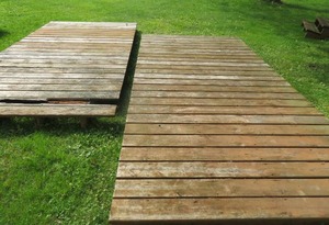 lot 27 image: 2 LARGE PIECES OF TREATED LUMBER DECKING.