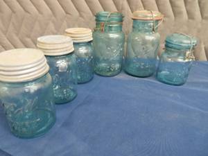 lot 76 image: VINTAGE  BLUE MASON JARS