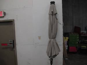 lot 681 image: SunVilla 10-foot Tiltable Market Umbrella - Tan