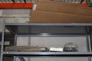 lot 485 image: Contents of Shelf - Cardboard Flats, Storage Bins, Electric Motor, Spool of Strapping, Misc. Items