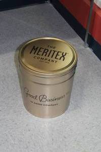 lot 629 image: The Meritex Company Est. 1916 Good Business in Good Company Tin Container with Lid