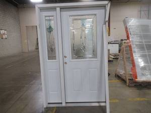 JELDWEN 36 in Prehung Exterior Steel Door with Side Half Lite Double Bore - DAMAGE ON WEATHER STRIPPING AND DENT ON INTERIOR SIDE OF DOOR - SEE PHOTOS
