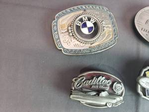 lot 113 image: BMW, Cadillac, Vikings Belt Buckles