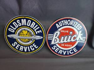 lot 122 image: Ande Rooney Steel and Porcelain Reproduction Oldsmobile and Buick Signs