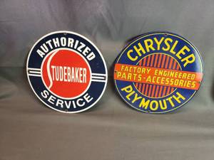 lot 124 image: Ande Rooney Steel and Porcelain Reproduction Studebaker and Chrysler Signs