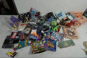 lot 137 image: Assorted Mystery Bag Items - Socks, Apron, Stickers