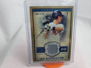 lot 49 image: Joe Mauer Relic AL Artifacts Patch Numbered 148325